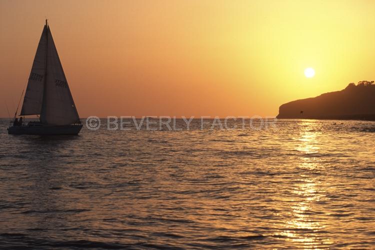 Sunset Island;colorful;yellow;sunset;sky;water;sail boat;pink;sillouettes;boat;Dana Point;California